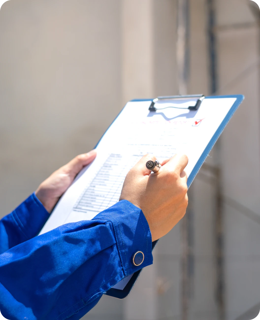 Worker holding clipboard and pen